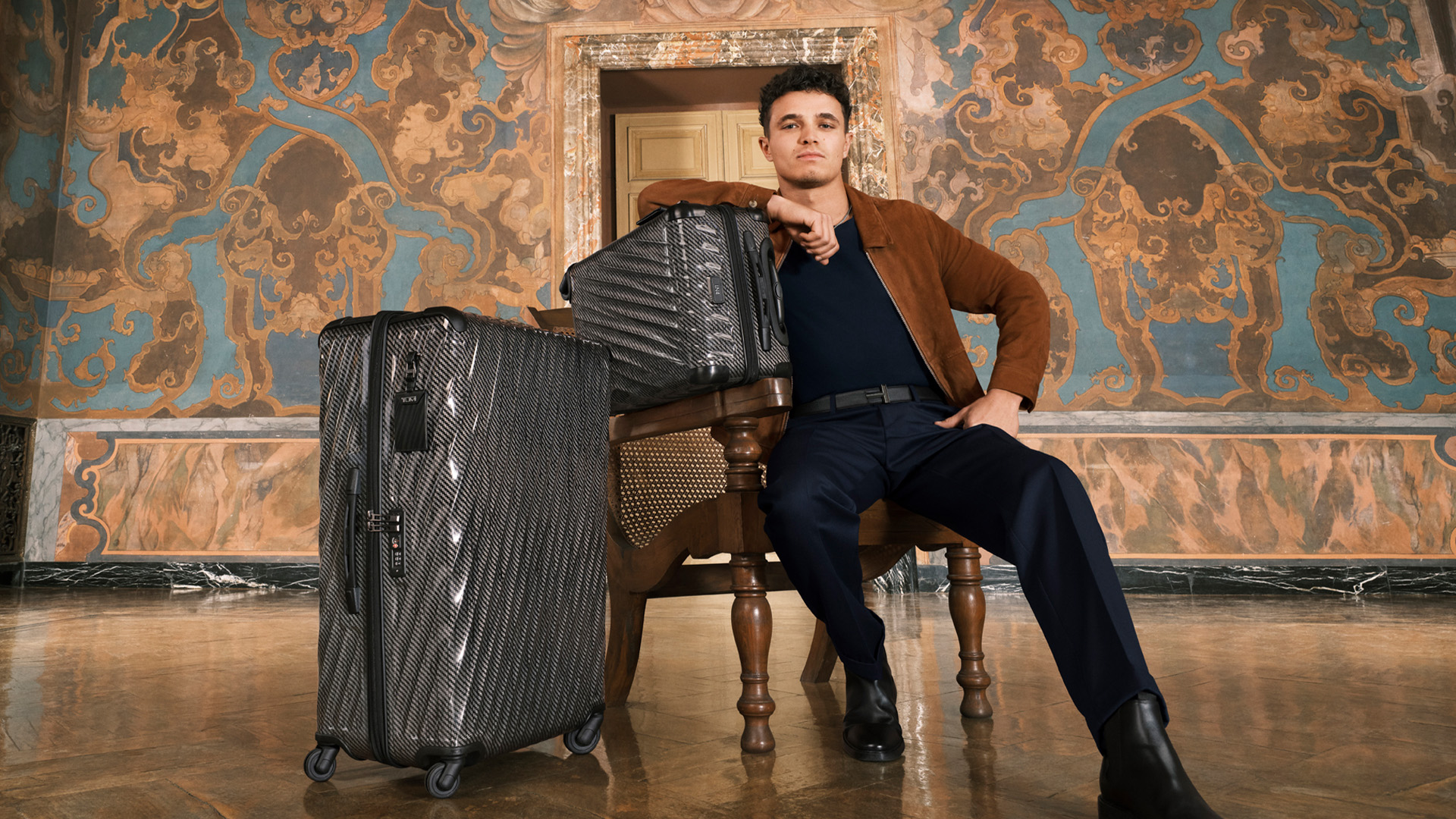Lando Norris with 19 Degree Lite International Carry-On and Extended Trip Packing Case in Black Graphite